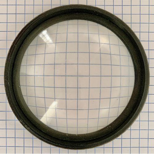 Photograph of a 50 mm f/0.7 lens cast in epoxy